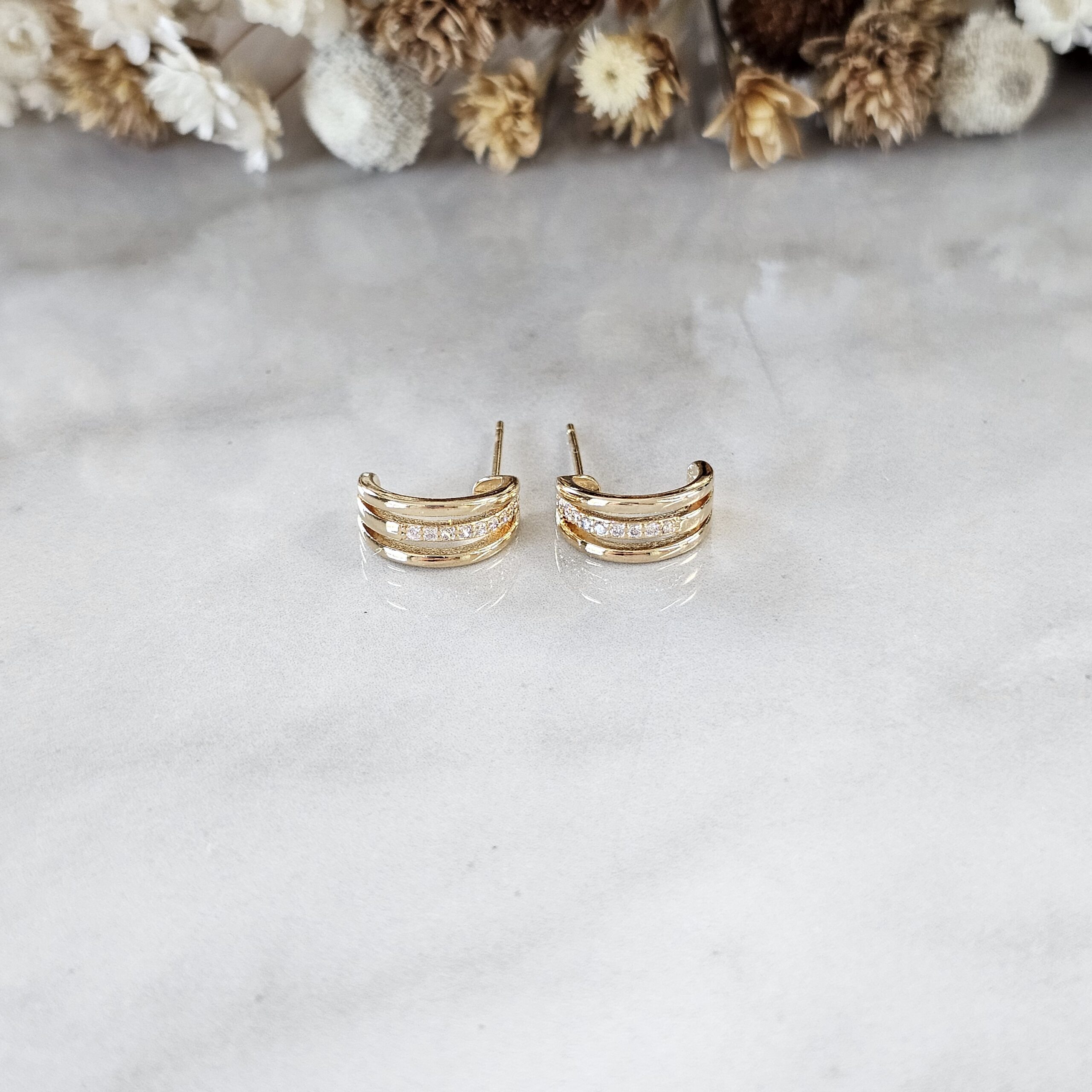 BRINCO MEIA LUA COM ZIRCÔNIAS